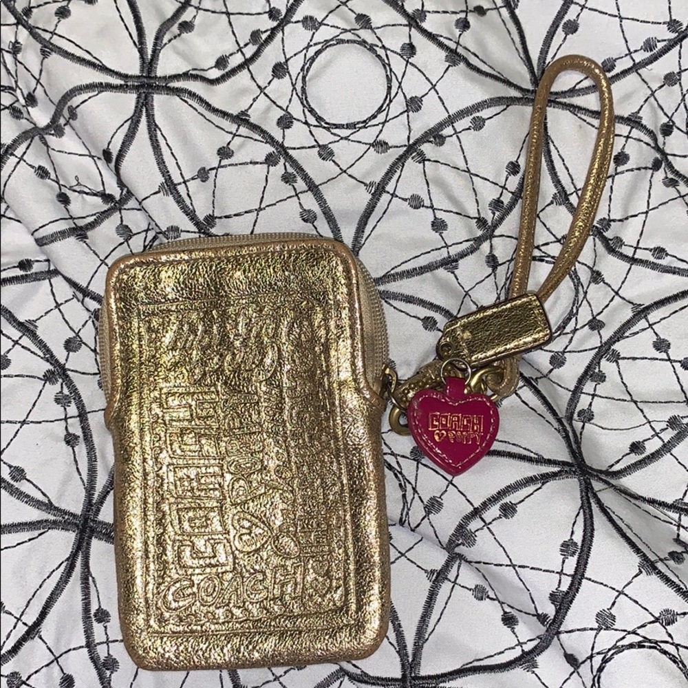 Coach Gold wrist wallet used
